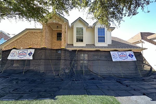 Banner Roofing Roof Replacement sized Banner Roofing netting around home to catch roofing debris